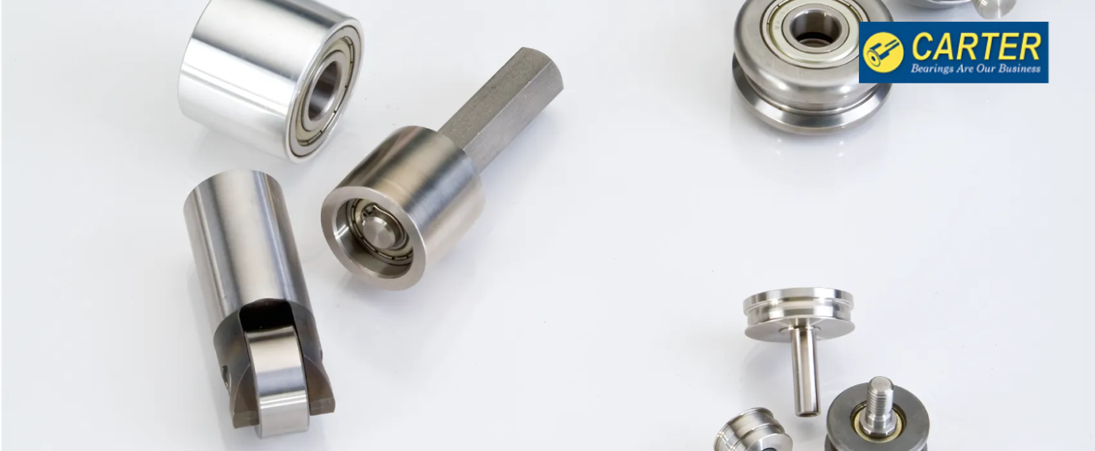 A variety of Carter Bearings specialty products, including custom cam followers, track rollers, and guide wheels for industrial automation.